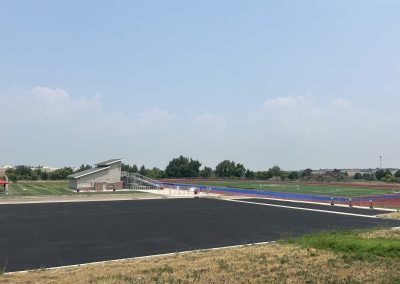 New asphalt parking lot and driveway at a sports venue