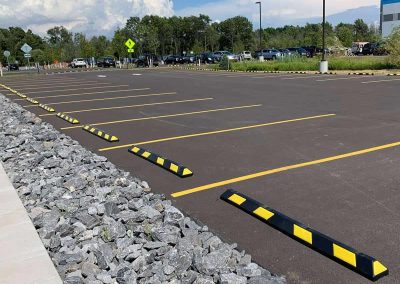 Custom striping and auto stop installation in a commercial lot
